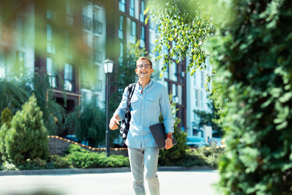 IT specialist feeling motivated while walking to office in the morning